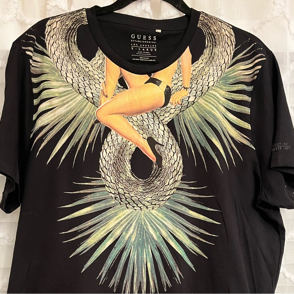 Brand: Guess graphic tee shirt.